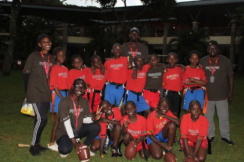 Coach guiding the flag football team — Talent