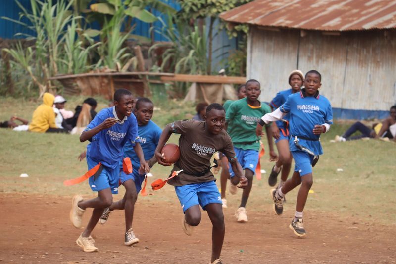 Team huddle during flag football — Talent