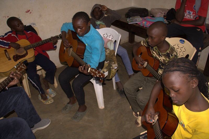 Young guitarist practising chords — Talent